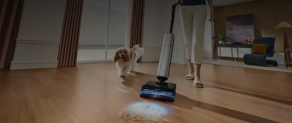 Dreame Aero Ultra Steam applying FoamWash™ enzyme foam to a spot on hardwood, dog nearby.