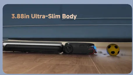 Cordless wet dry vacuum laid flat to clean under a sofa on a wood floor, dog resting nearby.
