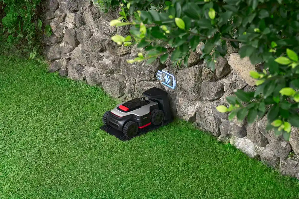 Auto lawn mower returning to its charging dock mid-mow to recharge