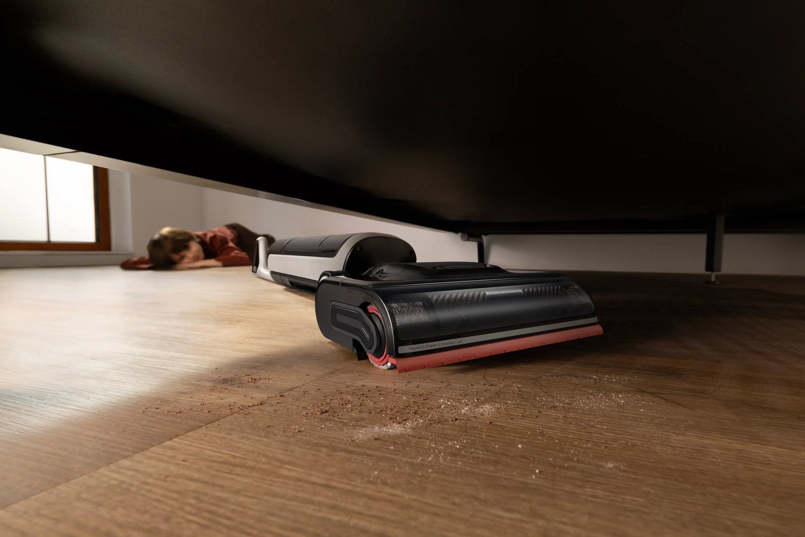 Dreame H15 Pro Heat lying 180° flat to clean under furniture on hardwood.