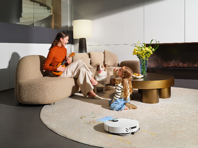 Dreame robot vacuum auto-detecting a carpet and cleaning around it with the mop lifted.